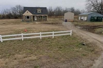 Incredible Real Estate Opportunity: 4-Bedroom Home with Acreage and Detached Garage in Augusta, Kansas