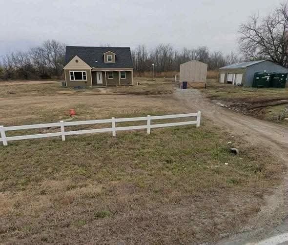 Incredible Real Estate Opportunity: 4-Bedroom Home with Acreage and Detached Garage in Augusta, Kansas
