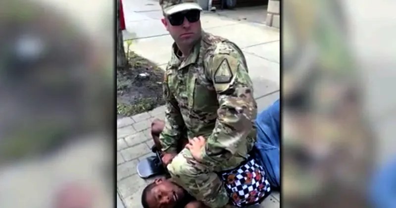Man In Military Fatigues Flattens Man With Haymaker, Sits On His Chest