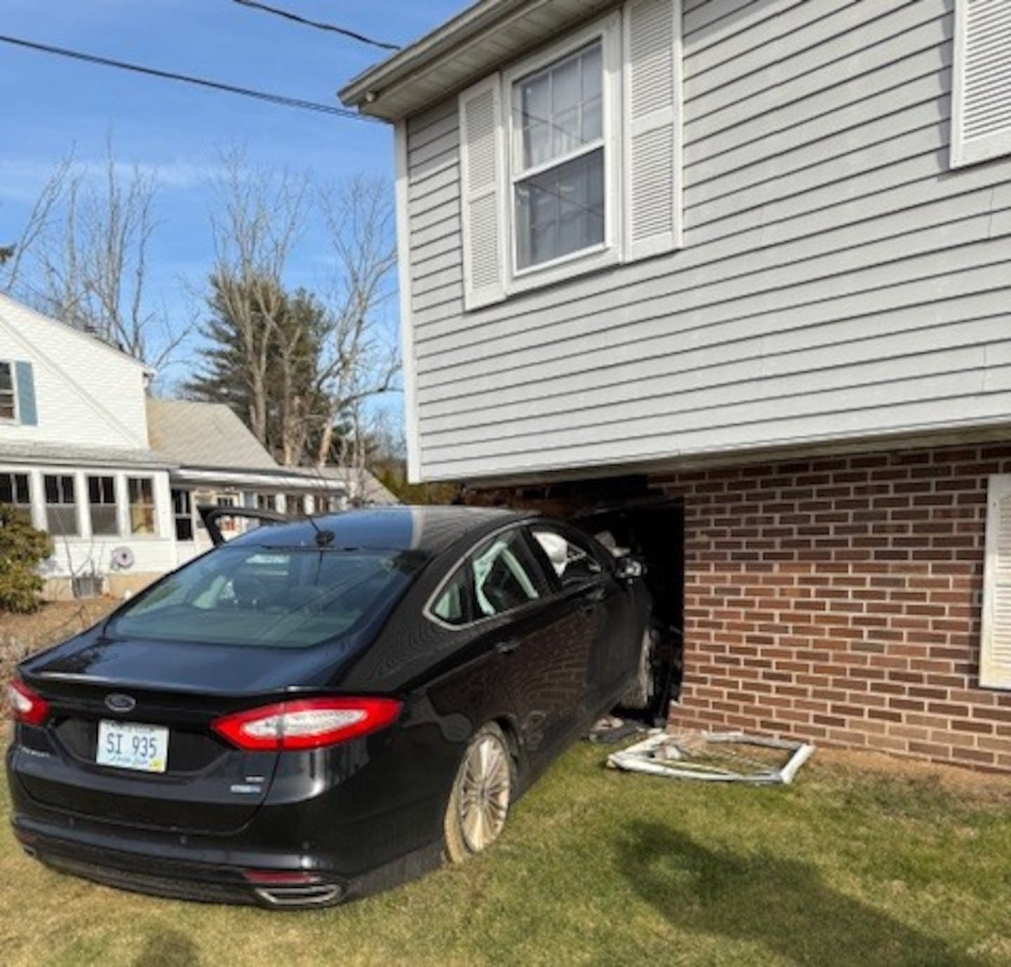 Suddenly stricken driver crashes into house in Raynham